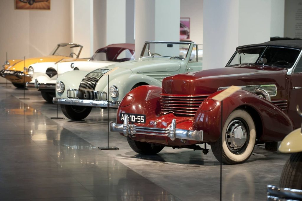 Row of classic cars in the Automobile & Fashion Museum